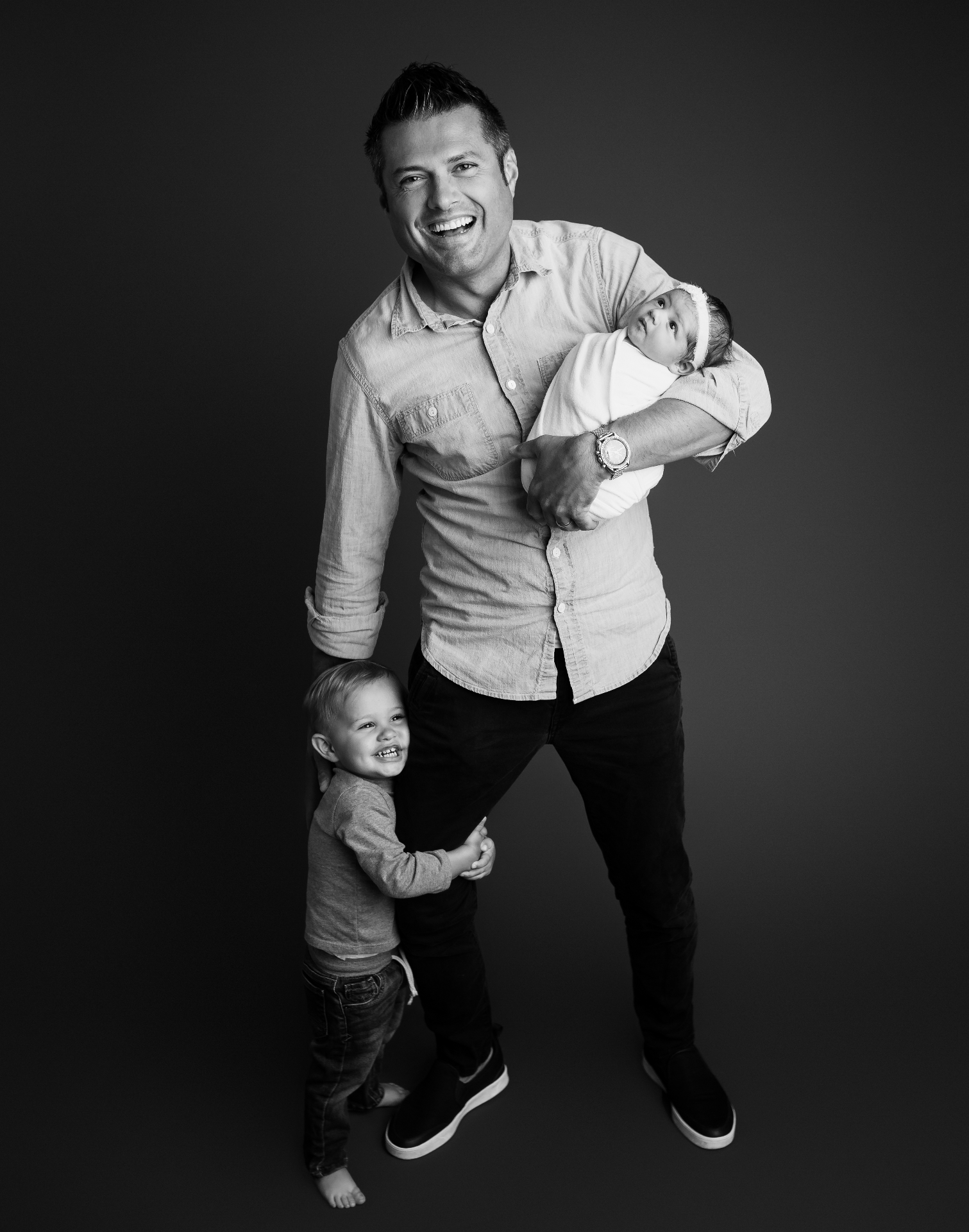 John Bikis, Founder of Decebal, holding his two children